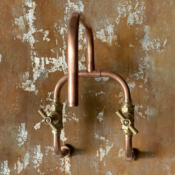 Loop is a wall mounted copper faucet for kitchen or bathroom, indoor or outdoor, made from exposed copper pipe and brass by Switchrange