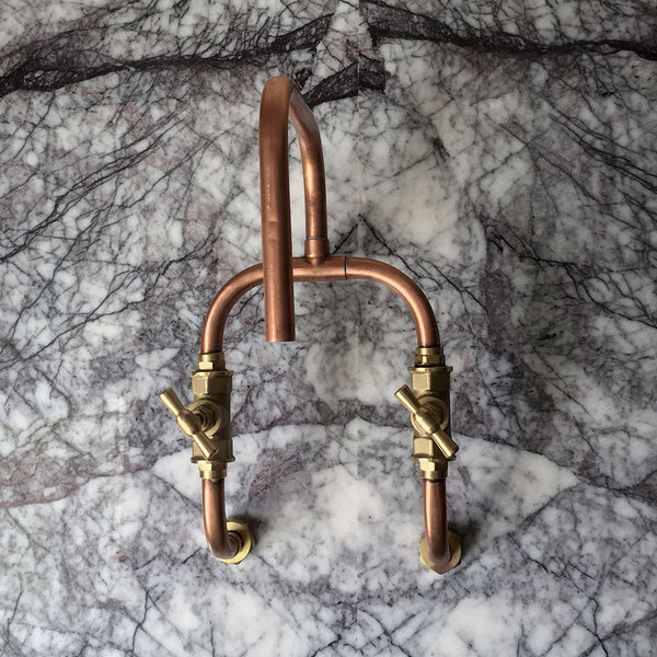 Loop is an indoor or outdoor wall mounted copper kitchen or bathroom tap made from real copper pipe and brass by Switchrange